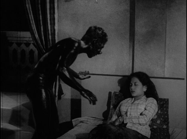 Still from 'Orang Minyak' (Film source: Asian Film Archive. Courtesy of ©Cathay-Keris Film Pte. Ltd.)    